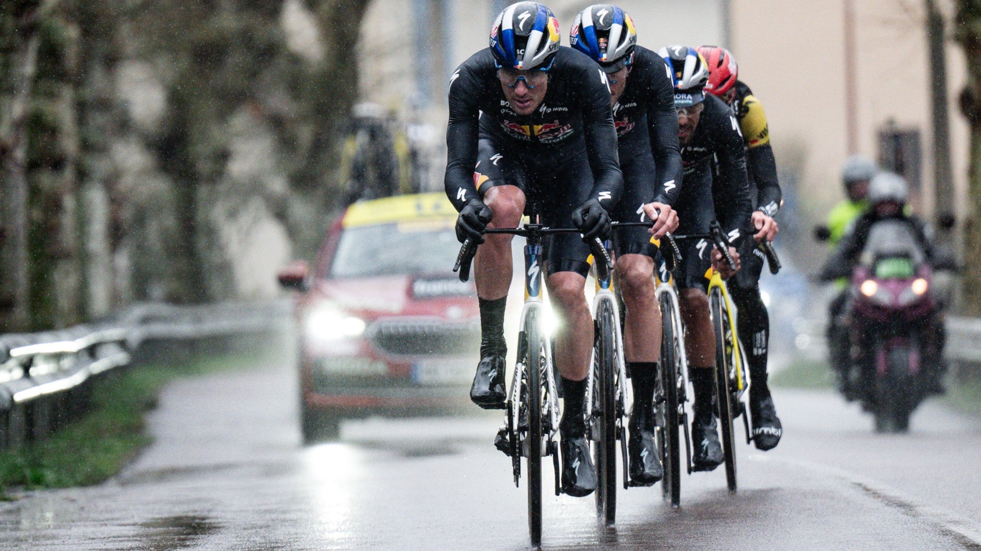 Red Bull BORA cycling team members racing in rainy northern Europe with K-Edge cycling computer mounts